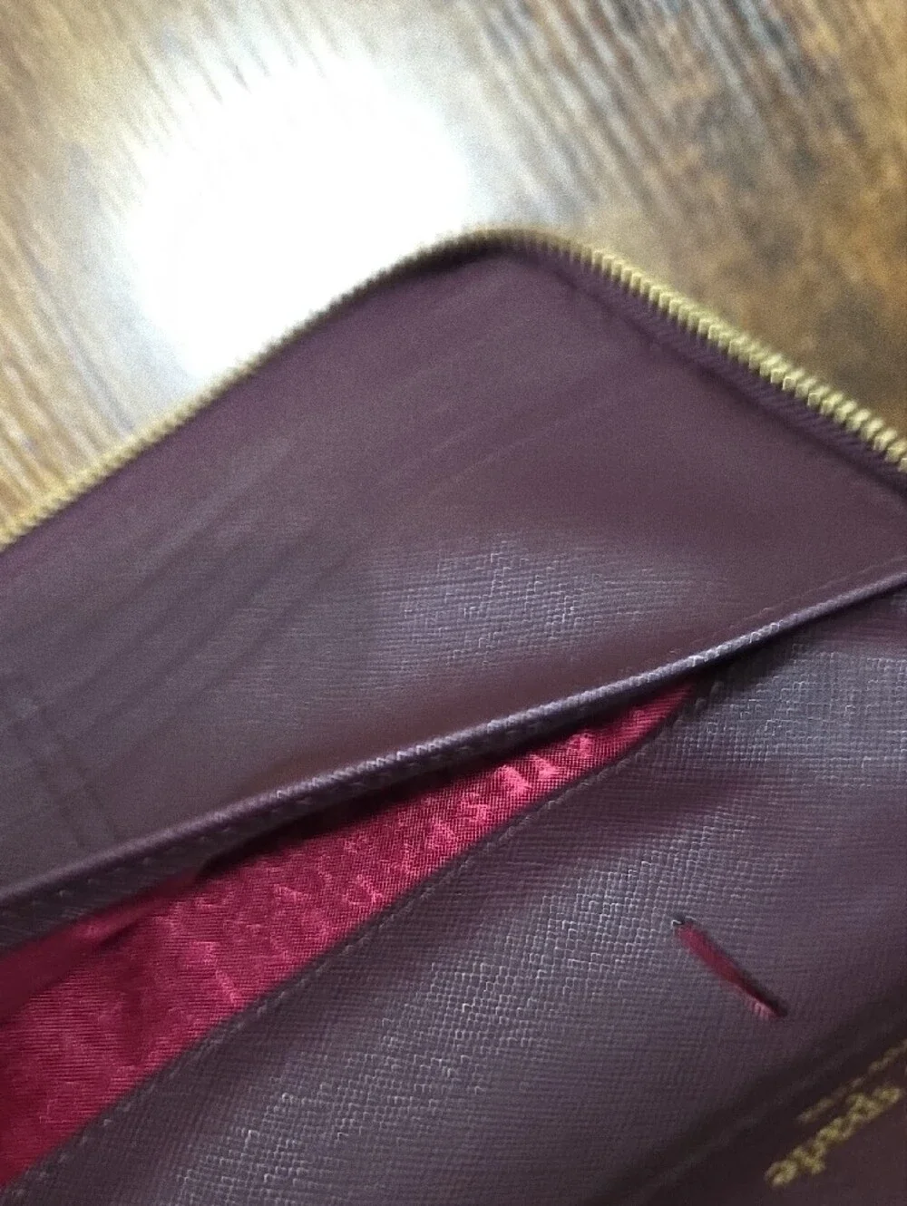 kate spade deep plum Saffiano zip-around leather wallet